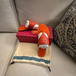 I’m selling a brand new pair of Poppy Red Tory Burch sandals.